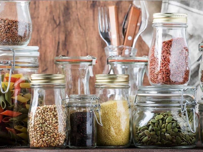 Different Size of Glass Jars fill with useful seeds, cereal and pasta